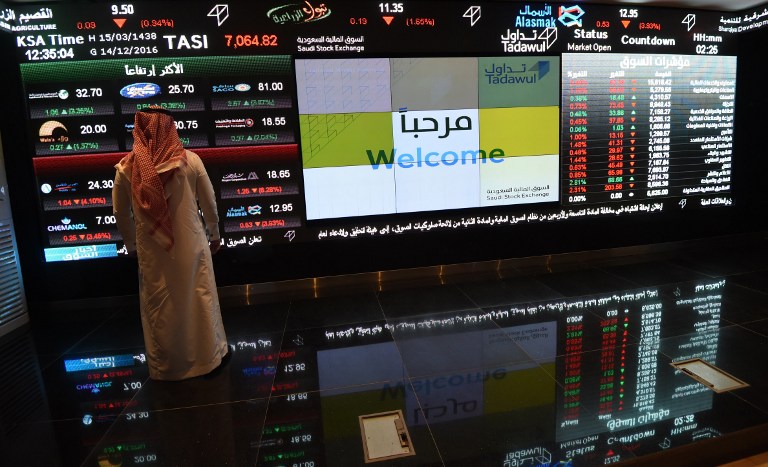 A Saudi investor monitors the stock exchange at the Saudi Stock Exchange, or Tadawul, on December 14, 2016  in the capital Riyadh. / AFP PHOTO / FAYEZ NURELDINE