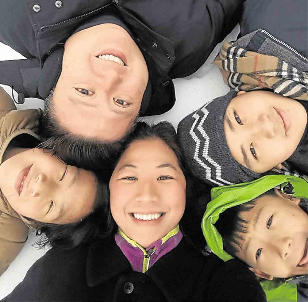 Quennie Cua (center) with kids  Kaitlyn (11), husband Patrick, Josh (13) and Nigel (9) 