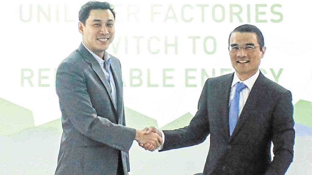 Unilever, represented by Yap (L), agreed to source its energy needs from Lopez-led First Gen.