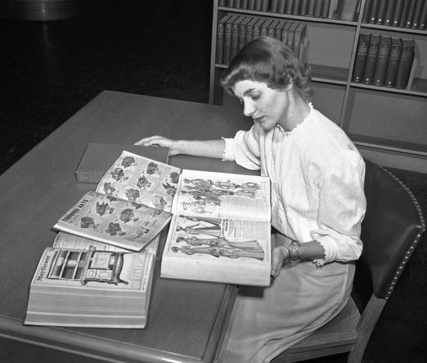 Librarian reading Sears catalog