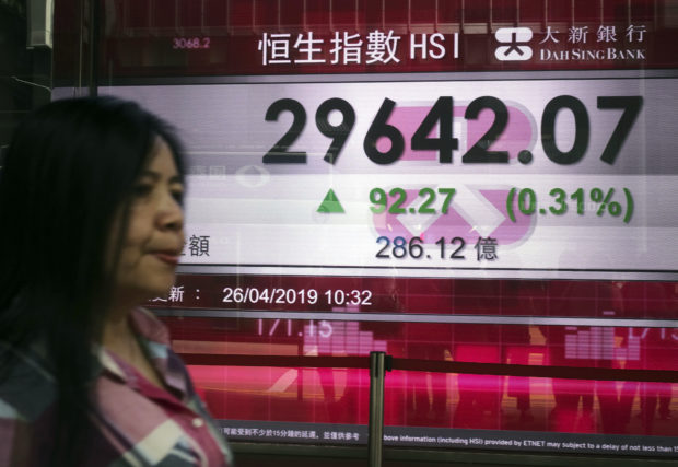  Asian shares fall on China stimulus worries, patchy earnings