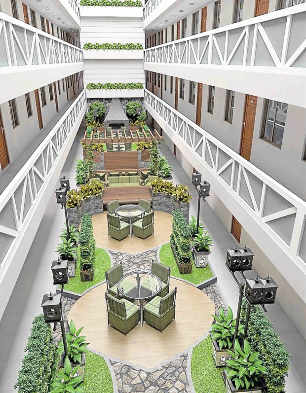 atrium amenity area of a condo development in tagaytay with chairs and tables and green indoor plants