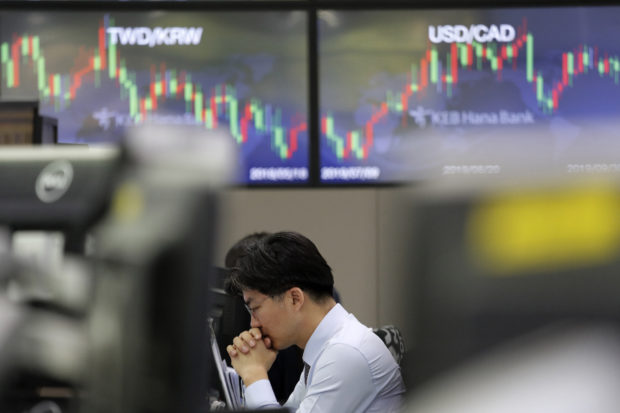  Asian shares mixed as Chinese markets head into holidays