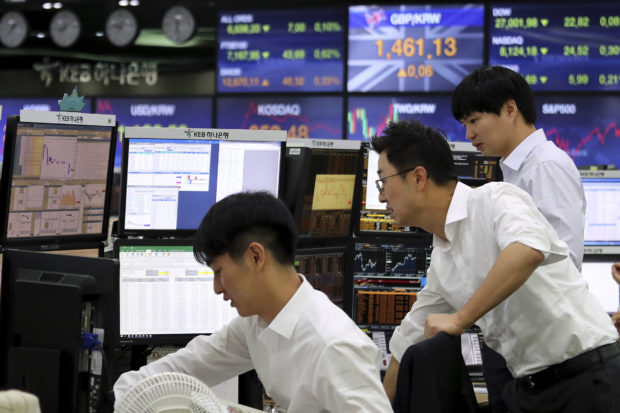  Asian shares mixed on caution over China-US trade deal