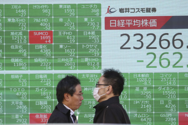 Asian shares slip after US stock tumble amid trade tensions