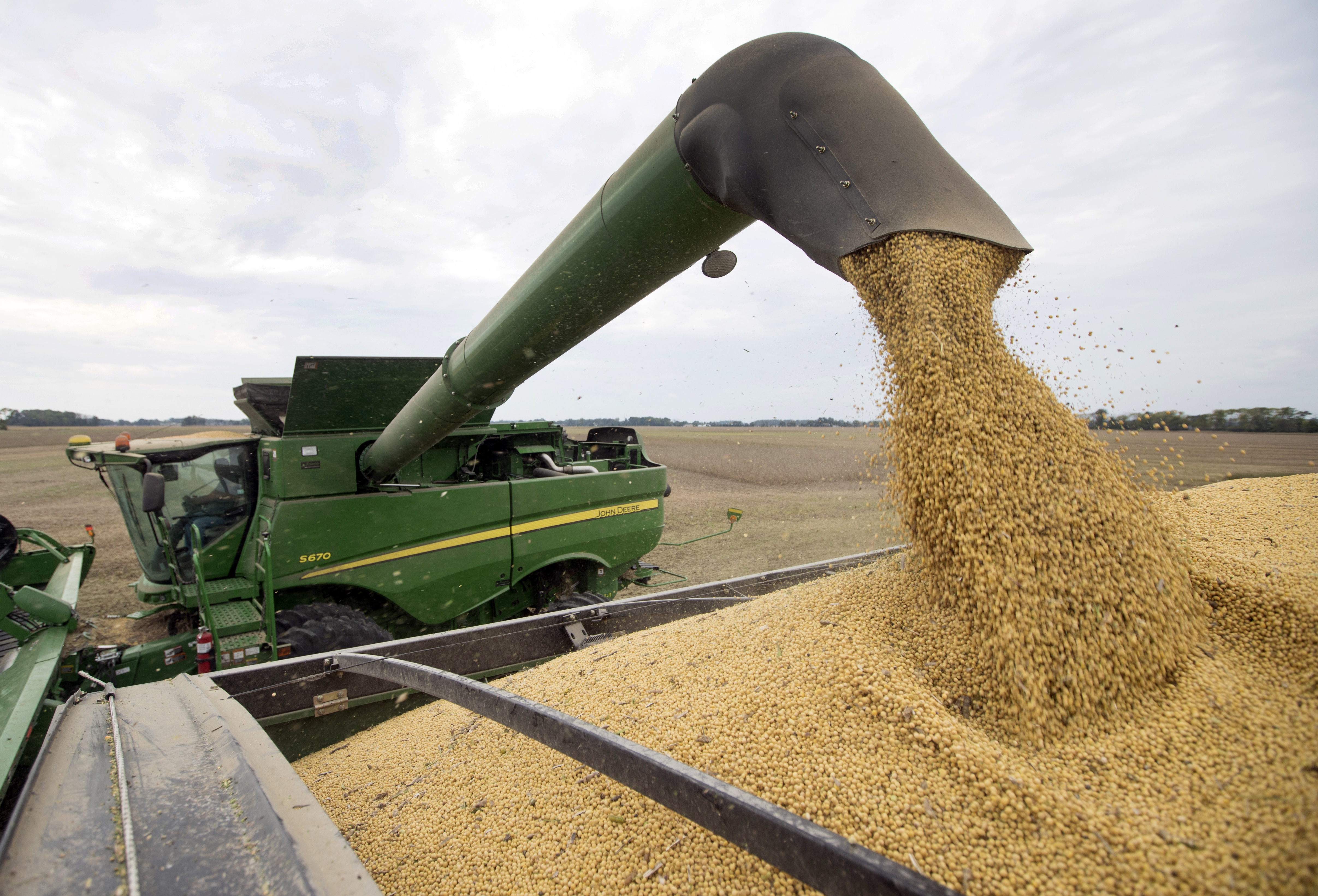 China waiving tariff hikes on US soybeans, pork