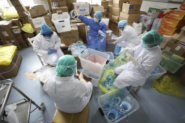 Nurses assembling face shields in Wuhan hospital