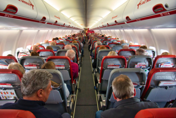 The busy cabin of a Jet2 airplane travelling from Manchester (MAN) to Madeira (FNC) - the plane is G-JZHG, a Boeing 737-85P built in 2020.