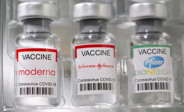 Vials labelled "Moderna, Johnson & Johnson, Pfizer-BioNTech coronavirus disease (COVID-19) vaccine" are seen in this illustration picture