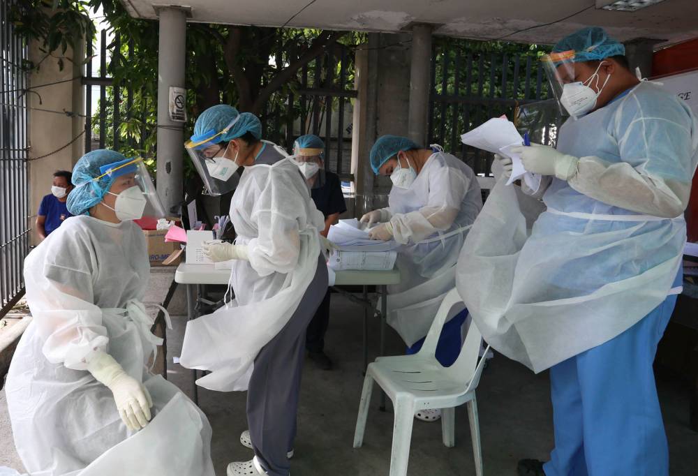 Healthworkers dispensing their duties at the Santa Ana hospital in Manila.