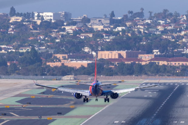 FILE PHOTO: A Southwest Airlines plane approaches to land at San Diego International Airport as U.S. telecom companies, airlines and the FAA continue to discuss the potential impact of 5G wireless services on aircraft electronics in San Diego, California, U.S., January 6, 2022. REUTERS/Mike Blake