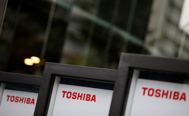 Photo of Toshiba logos in exterior signs for story: Toshiba Corp. now plans to split into two, bumps up shareholder return targets