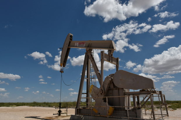FILE PHOTO: A pump jack operates in the Permian Basin oil production area near Wink, Texas U.S. August 22, 2018. Picture taken August 22, 2018. REUTERS/Nick Oxford/File Photo