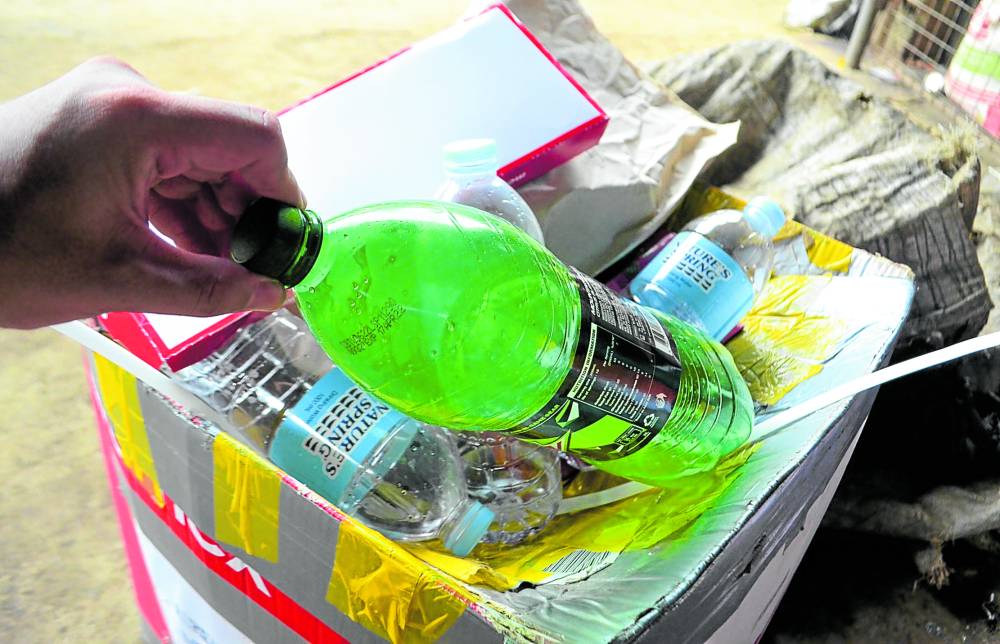 UP FOR RECYCLING   Plastic bottles are sold at P10 per kilo
