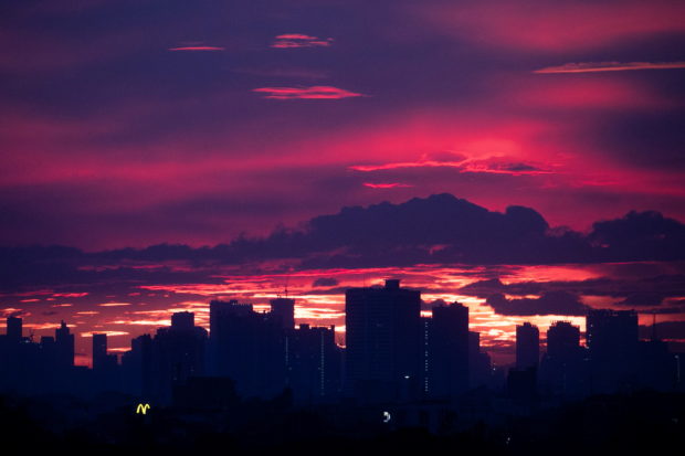FILE PHOTO: A silhouette of the skyline is pictured at sunset in Quezon City, Metro Manila, Philippines, November 27, 2020. REUTERS/Eloisa Lopez