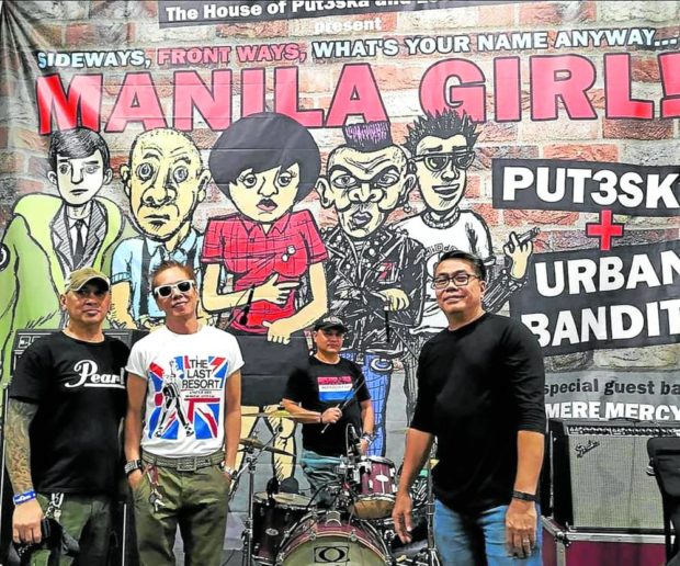 VISUAL ARTS   The band, Urban Bandits, with the backdraft created by Jerito dela Cruz.  —Photo courtesy of Urban Bandits facebook