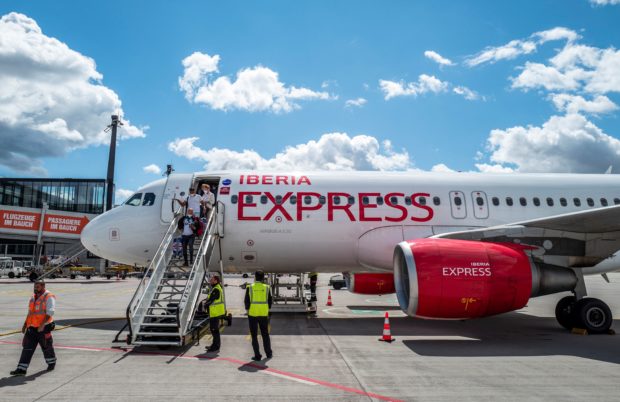 Passengers disembarking from Iberia Express 