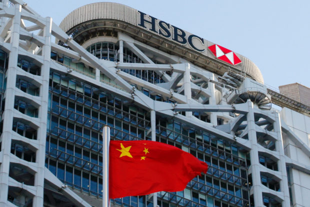 A Chinese flag in front of HSBC building