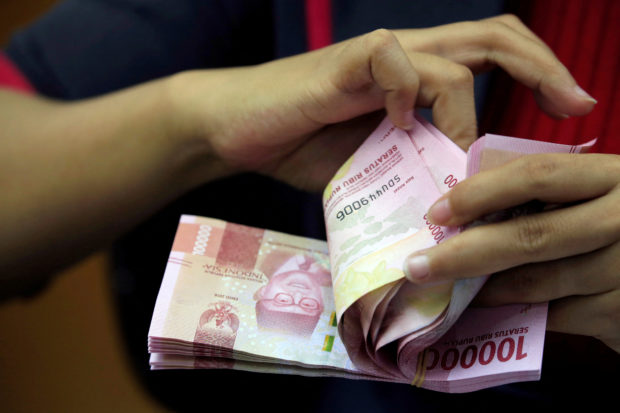 Indonesia rupiah bills being counted