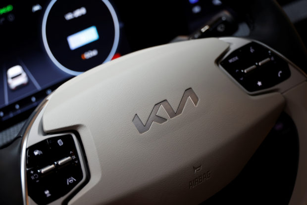 Logo of Kia on steering wheel
