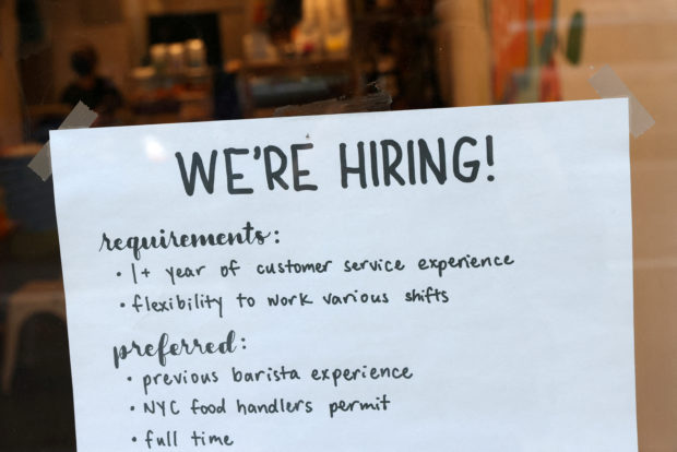 a hiring sign in a cafe in New York city