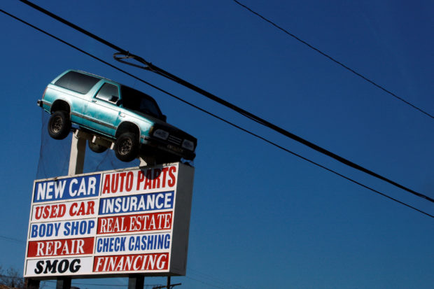 a sign advertising a car dealership
