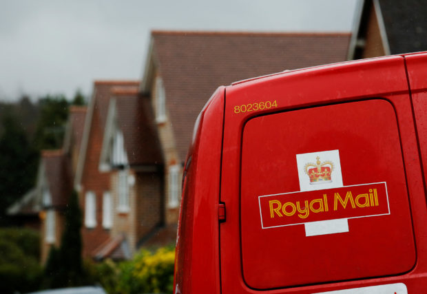 A red Royal Mail postal van