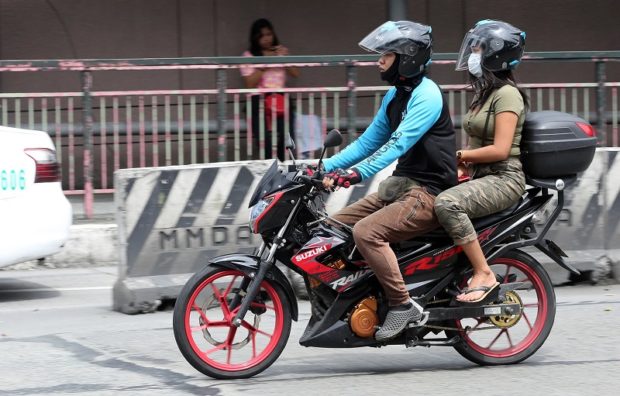 Angkas driver with passenger