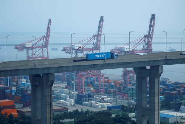 A truck carrying containers 