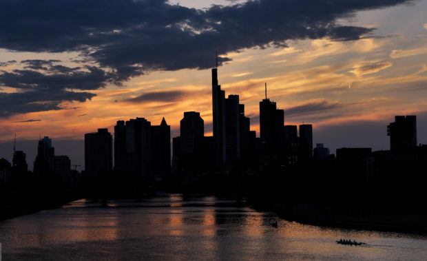 Sun sets behind skyline of Frankfurt