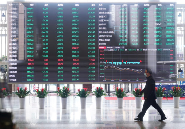 Man walking inside the Shanghai Stock Exchange