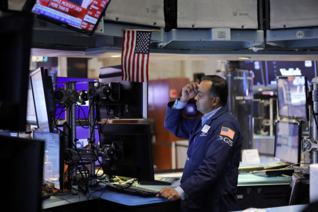 A trader on the NYSE trading floor