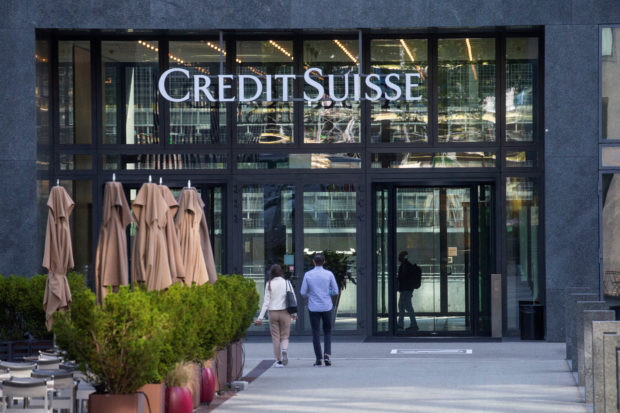 Credit Suisse logo seen in the entrance of its building