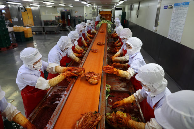 Employees at Cheongone Organic kimchi factory