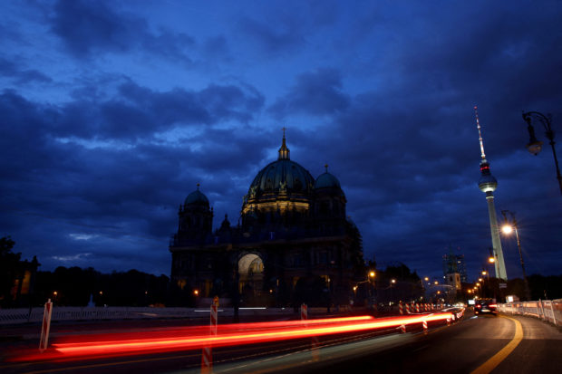 Television tower near Protestant Berlin Cathedral glows