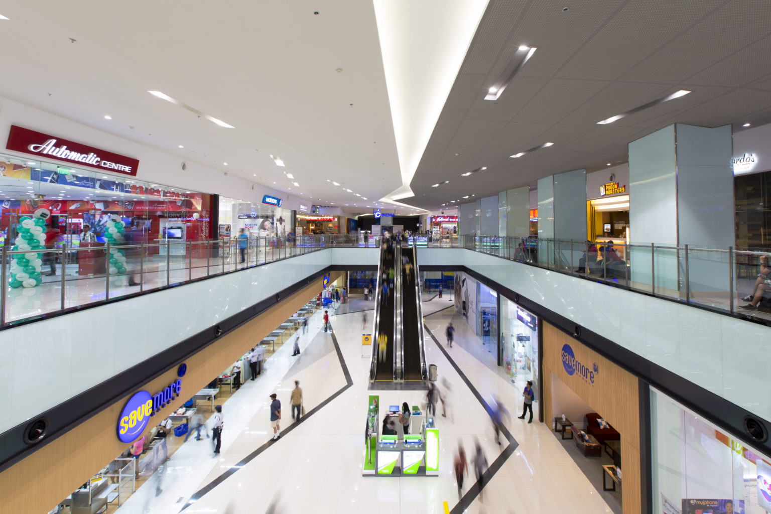 mall interior with two floors and two escalators as real estate investment
