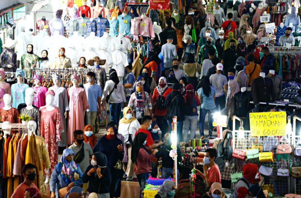 People shopping at a textile market