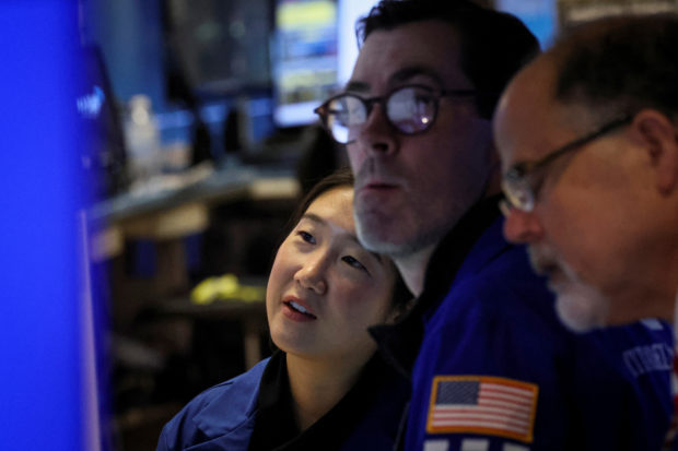 Traders at work at the NYSE