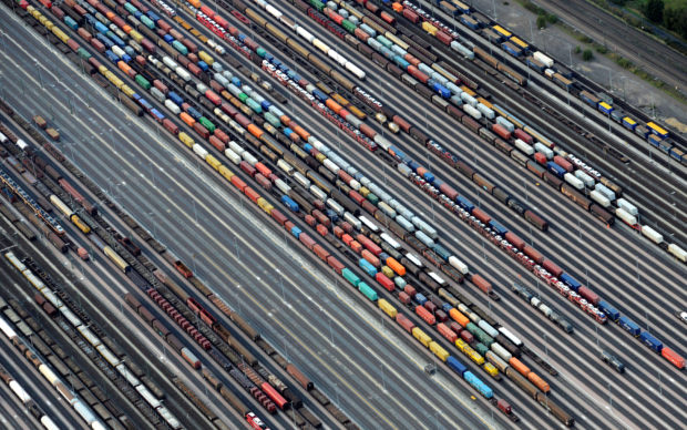 Containers and cars loaded on freight trains