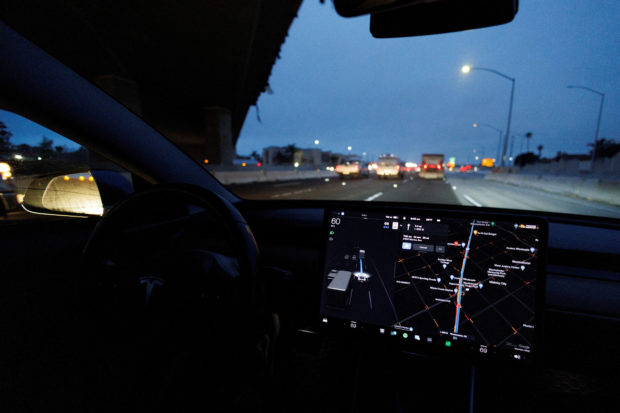 Tesla Model 3 vehicle drives on autopilot