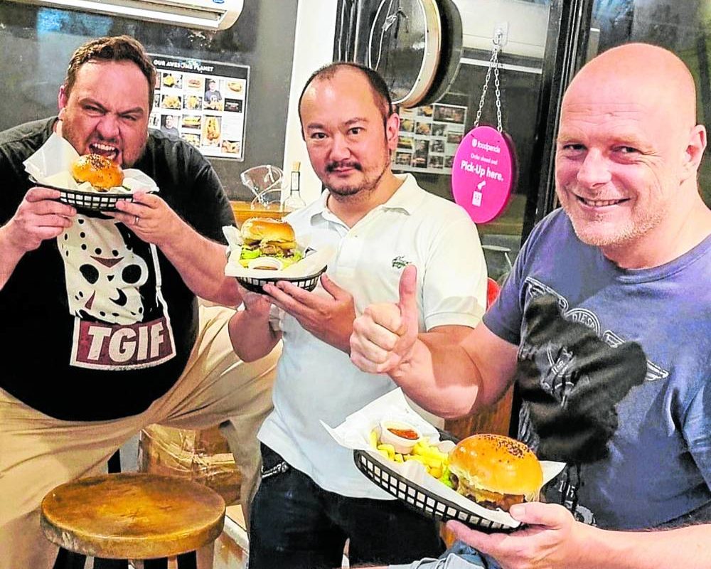 Three Guys and a Grill cofounder Duncan Gates (right) with business partners Tom Thurnherr (left) and Pepper Teehankee (center).