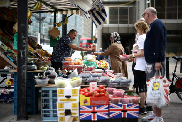 People at fruit and vegetable market in central London