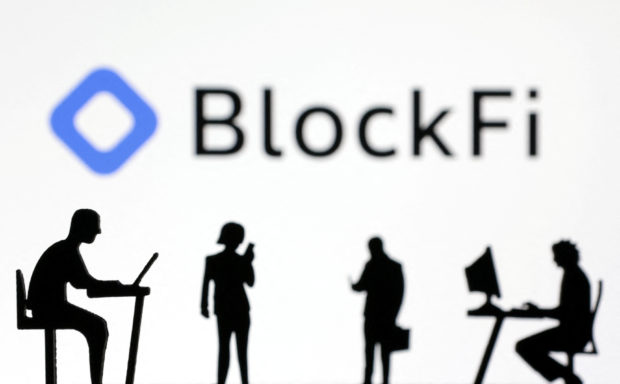Figurines in front of BlockFi logo