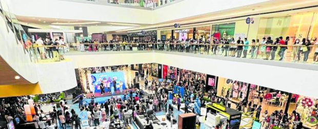 CONSUMER POWER Shoppers are back in droves with the easing of mobility protocols. —Photo by SM Mall of Asia