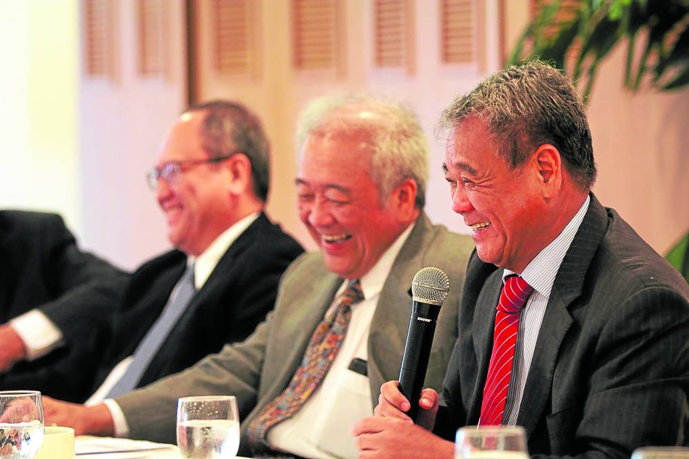 Jorge (left), Victor and Isidro Consunji share a light moment at the 2016 Semirara annual stockholders meeting. 
