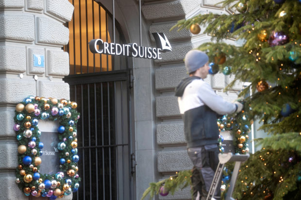 Christmas tree being decorated at Credit Suisse