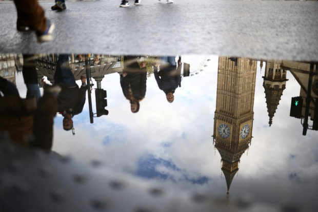 Big Ben reflected in a puddle