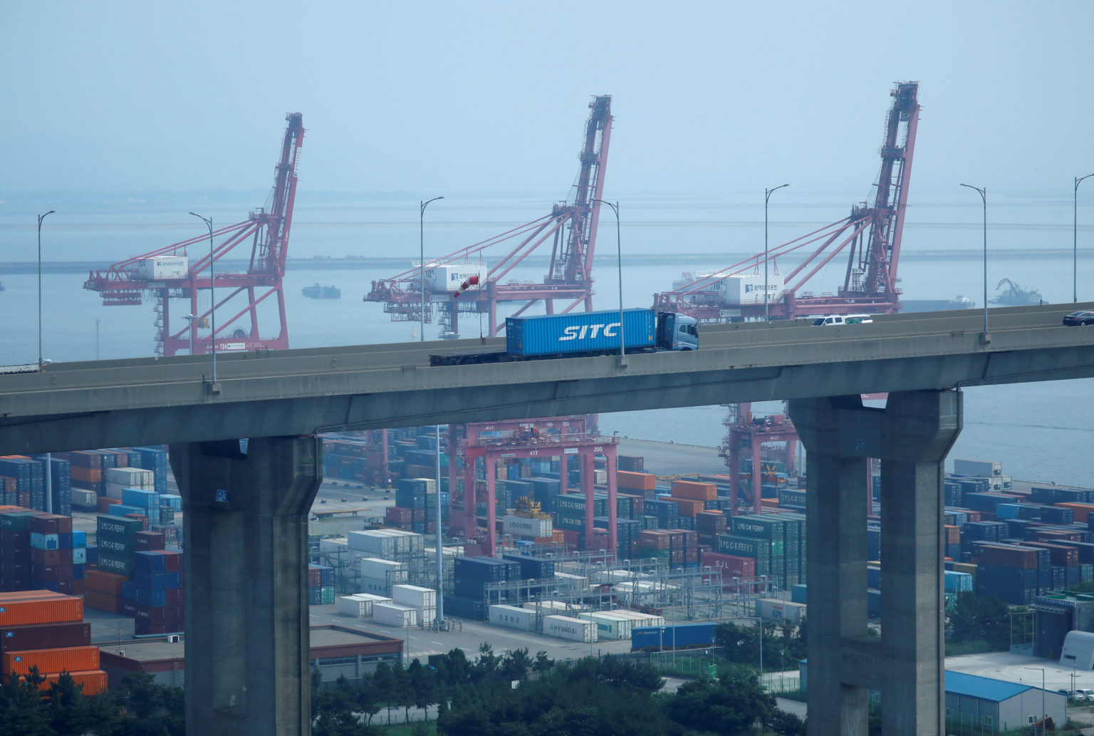 Truck carrying shipping container