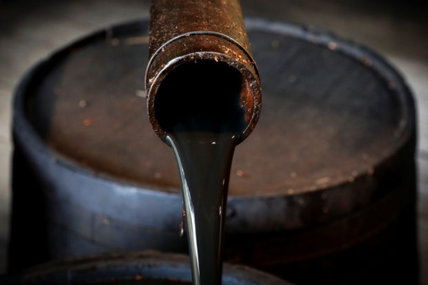 oil pours out of a spout