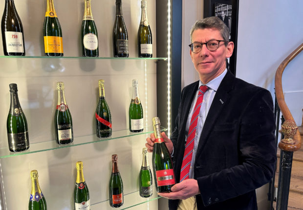 David Chatillon and Champagne bottles on display